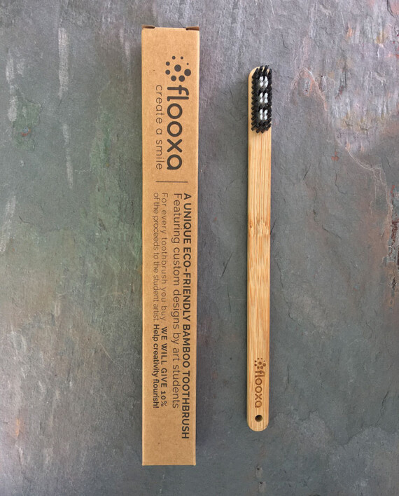 Bamboo toothbrush - Artwork by Charlotte Danois front view and packaging